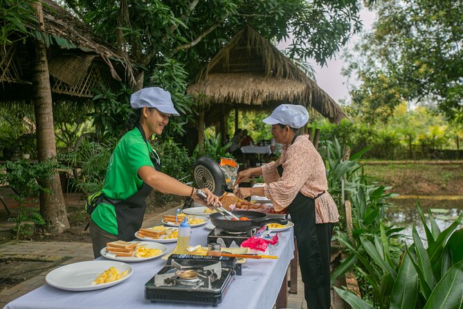 Angkor Sunrise Bike Tour / E-Bike or Tuk Tuk - Riding behind Angkor Wat and through the villages