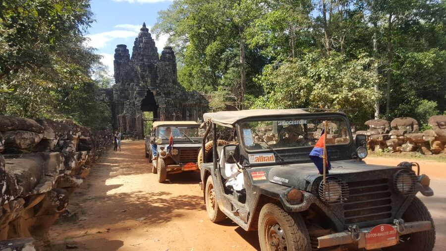 Angkor Wat in a vintage Jeep with driver - jeep rental - Ta Prohm and the trees over the ruins