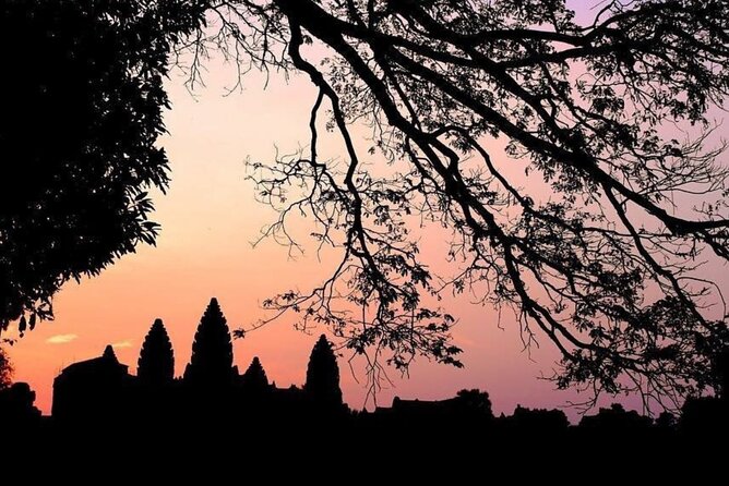 Angkor Wat Sunrise & 3 Main Temples with Breakfast – Small Group - Bayon puts the famous stone faces up close