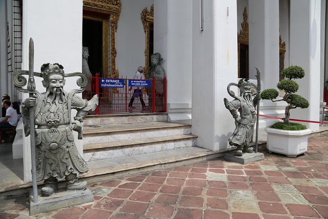 Bangkok Tuk Tuk Walk & Temple Tour With Wat Pho, Arun & Traimit - Getting around by BTS, boat, and tuk tuk