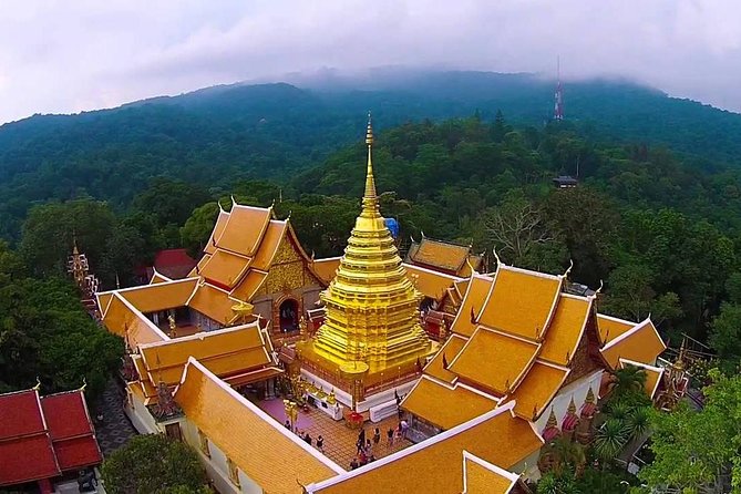 Doi Suthep and Hmong Hilltribe Half Day Tour in Chiang Mai - Climbing the 300-plus naga staircase
