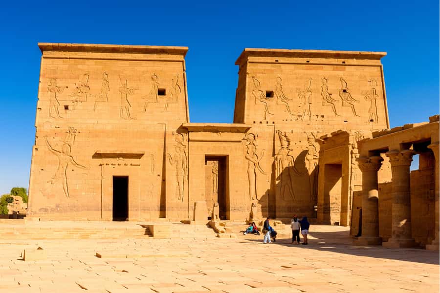 From Aswan: Philae Temple & Motorboat Tour to Nubian Village - Walking through the Temple of Isis