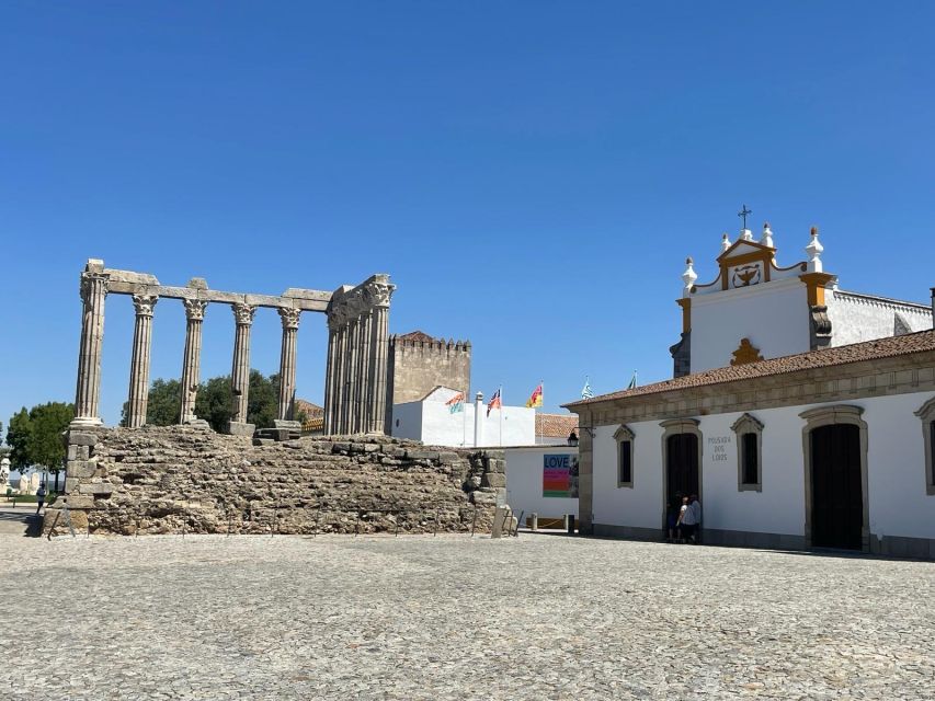From Lisbon: Évora, Chapel of Bones, & Roman Temple Tour - Walking into Évora’s old center