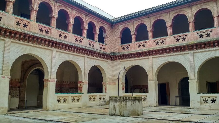 From Seville: Italica Roman City & Medieval Monastery Tour - Walking into the Roman city