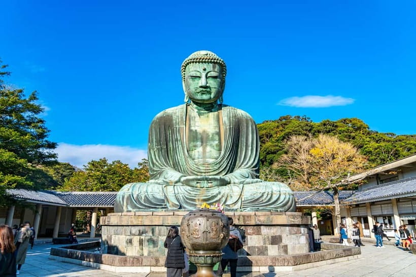 From Tokyo: Kamakura, Great Buddha, and Enoshima Bus Tour - The Enoden train along the seaside