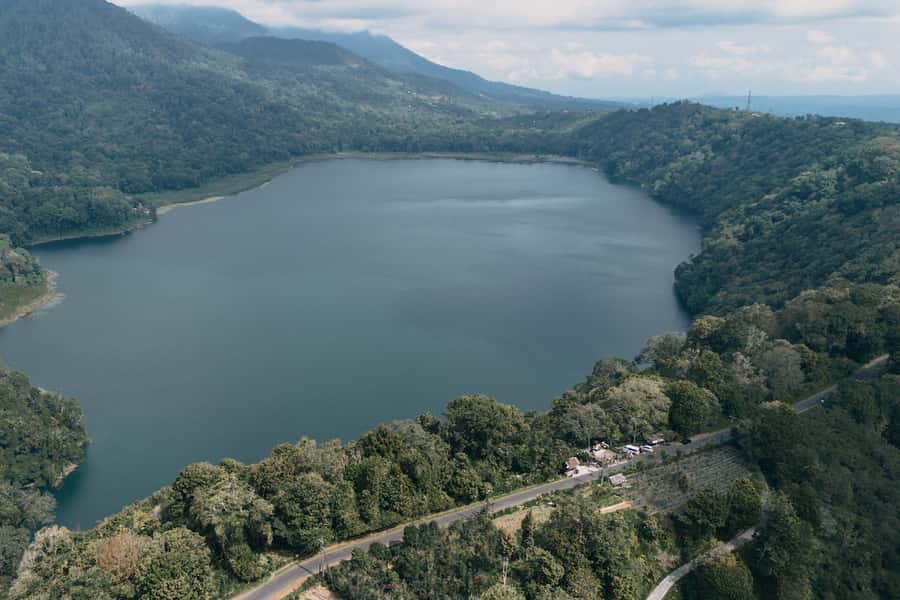 Munduk: Twin Lake Jungle Hike, Ulun Danu Temple, & Waterfall - Canoeing across Tamblingan Lake