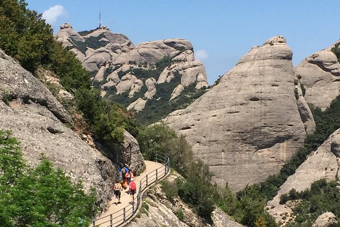 Semi-Private Montserrat Monastery, Funicular & Scenic Nature Walk - Leaving Barcelona in an eight-seat van