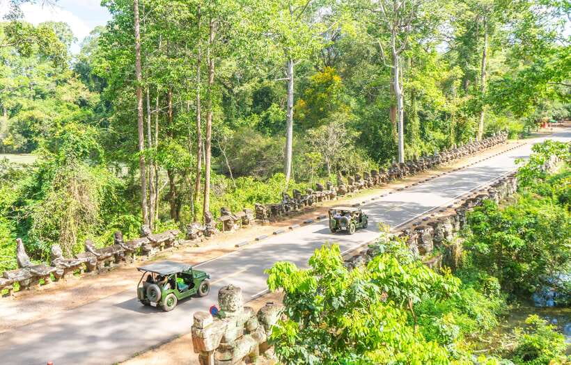 Siem Reap: Angkor Sunrise Jeep Tour / SUV Car Available - Bayon and Angkor Thom: faces, gates, and royal power