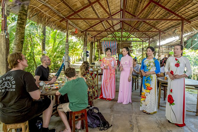 Small-Group Mekong Delta Day Trip: Boat Ride, Cottages & Pagoda - Garden paths, village cycling, and the narrow canal boat